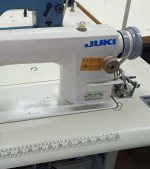 The Juki DDL-8700 is a high-speed, single-needle industrial sewing machine designed for precision straight stitching. It is widely used in garment manufacturing, tailoring shops, and textile industries due to its smooth operation, durability, and energy efficiency.