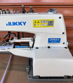 Juki Industrial Button Stitch Machine is a high-speed, precision sewing machine designed for attaching buttons securely in garment manufacturing.