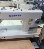 The Sewkey Walking Foot Machine is a heavy-duty sewing machine designed for thick and multi-layered materials, ensuring consistent stitching without fabric shifting.